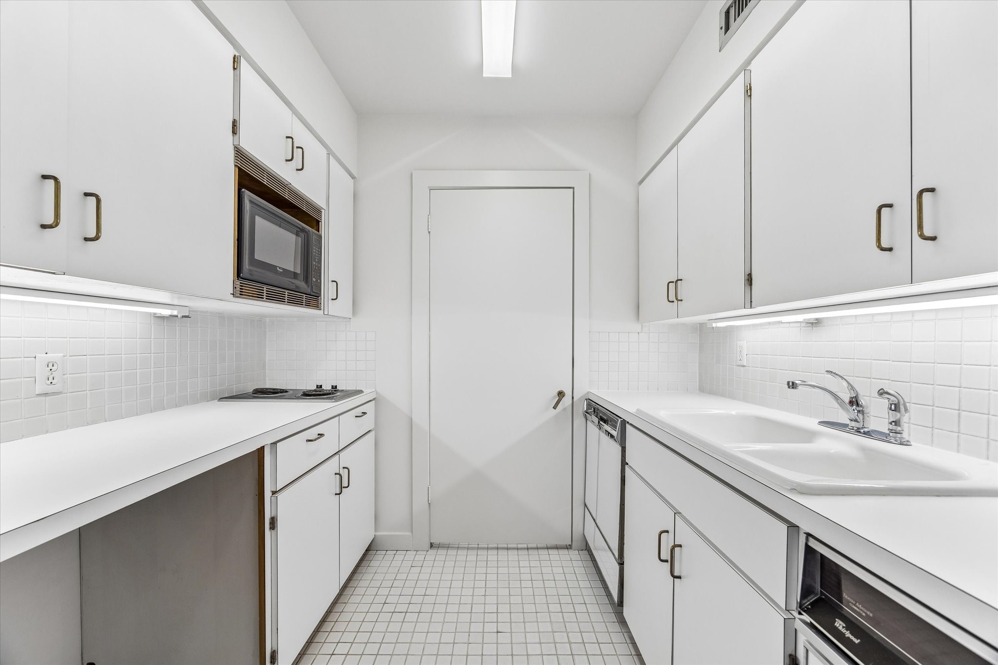 2402 Commonwealth Street Houston, TX 77006 - Photo 34 of 45 a utility room with cabinets washer and dryer