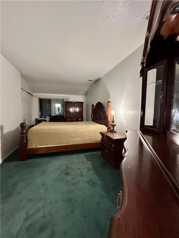 a bed room with a bed and a television