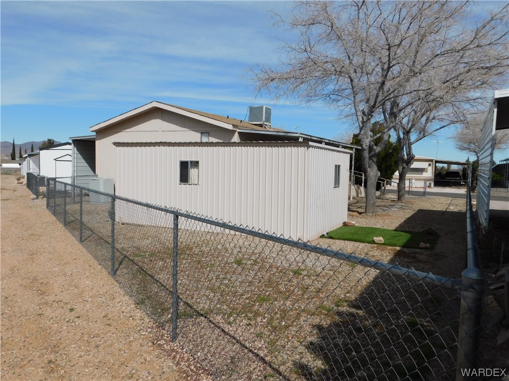 3003 Hualapai Mountain Road, Unit 55 Kingman, AZ 86401 - Photo 13 of 38 a view of a house with a yard