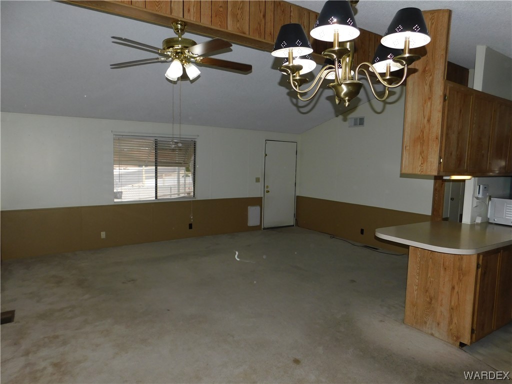 3003 Hualapai Mountain Road, Unit 55 Kingman, AZ 86401 - Photo 21 of 38 a view of a room with a chandelier furniture and a chandelier fan