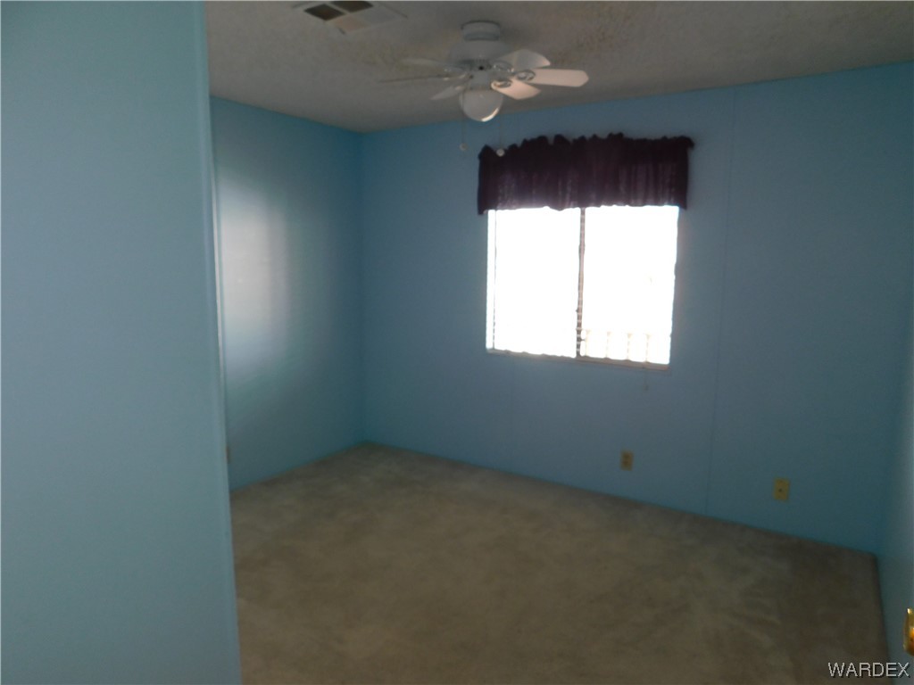 3003 Hualapai Mountain Road, Unit 55 Kingman, AZ 86401 - Photo 33 of 38 an empty room with a window