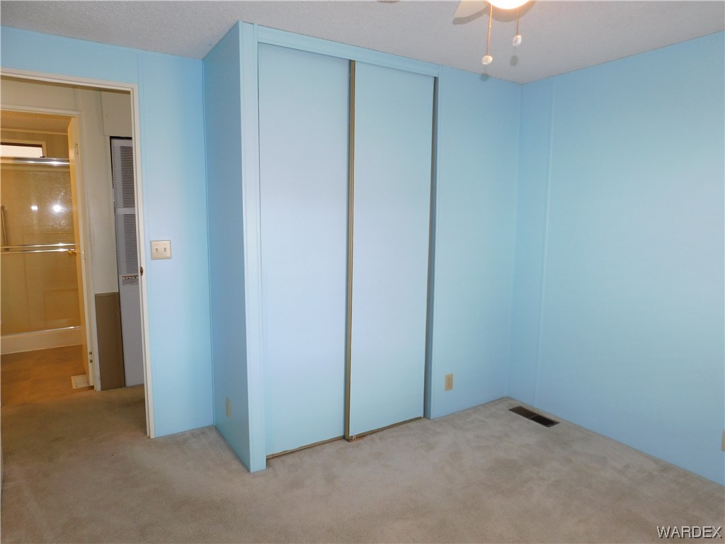 3003 Hualapai Mountain Road, Unit 55 Kingman, AZ 86401 - Photo 34 of 38 an empty room with closet area