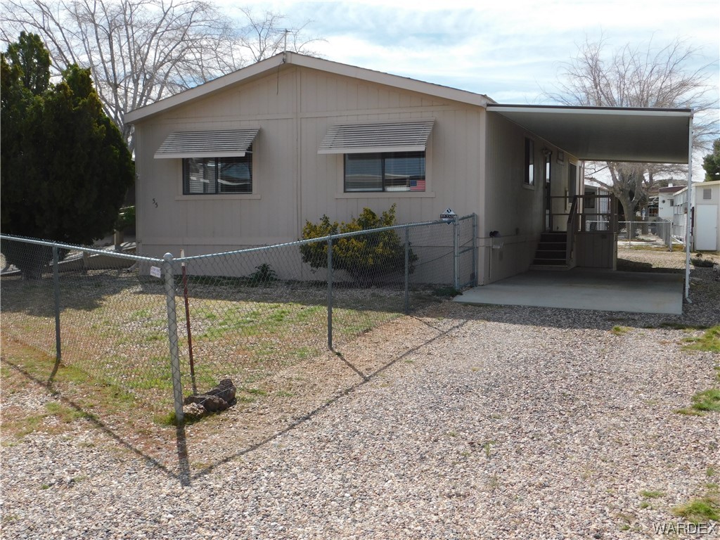3003 Hualapai Mountain Road, Unit 55 Kingman, AZ 86401 - Photo 5 of 38 a backyard of a house with entertaining space