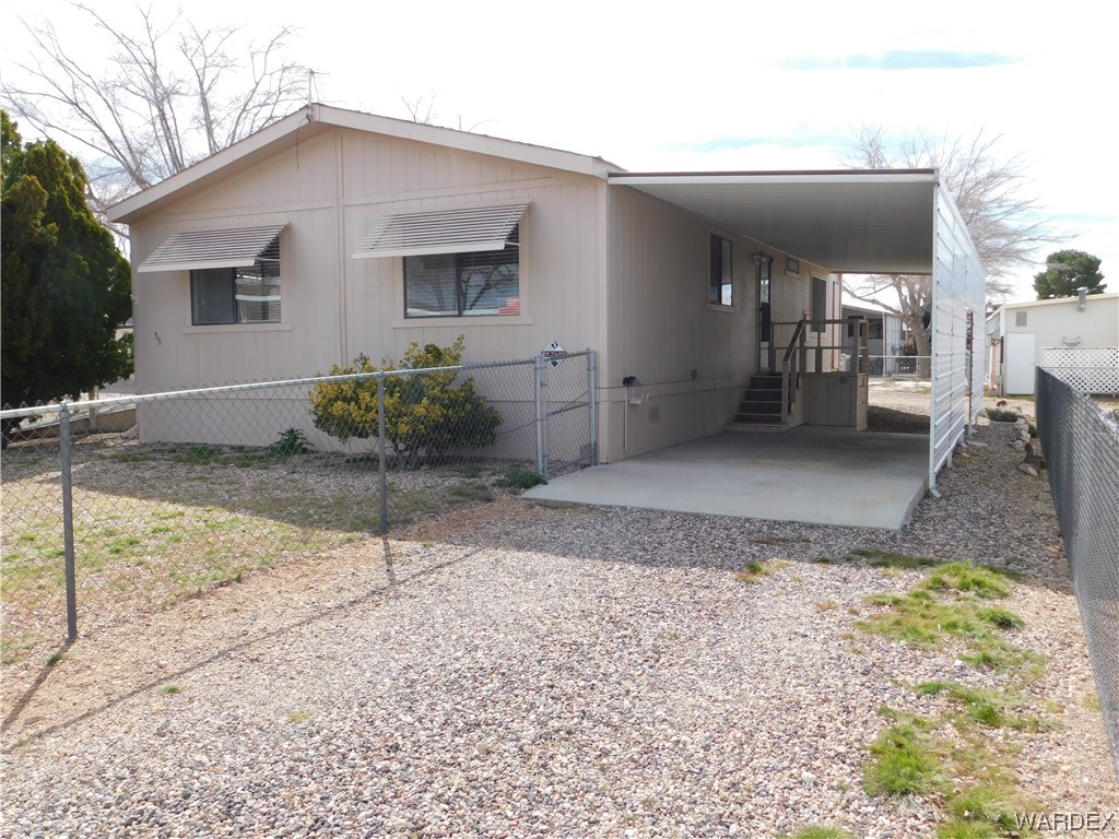 3003 Hualapai Mountain Road, Unit 55 Kingman, AZ 86401 - Photo 7 of 38 a backyard of a house