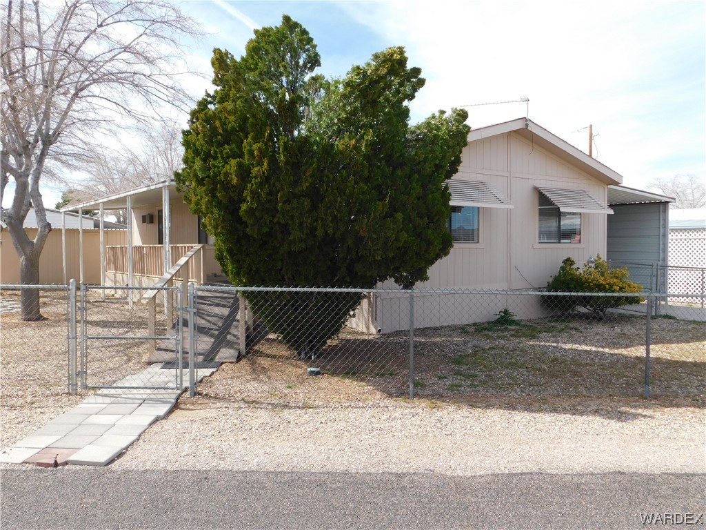 3003 Hualapai Mountain Road, Unit 55 Kingman, AZ 86401 - Photo 8 of 38 a house view with a outdoor space