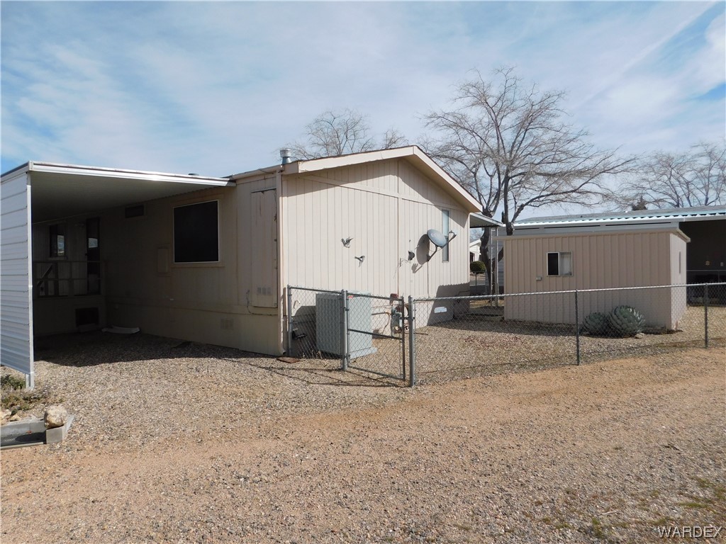 3003 Hualapai Mountain Road, Unit 55 Kingman, AZ 86401 - Photo 9 of 38 a view of a house with a yard