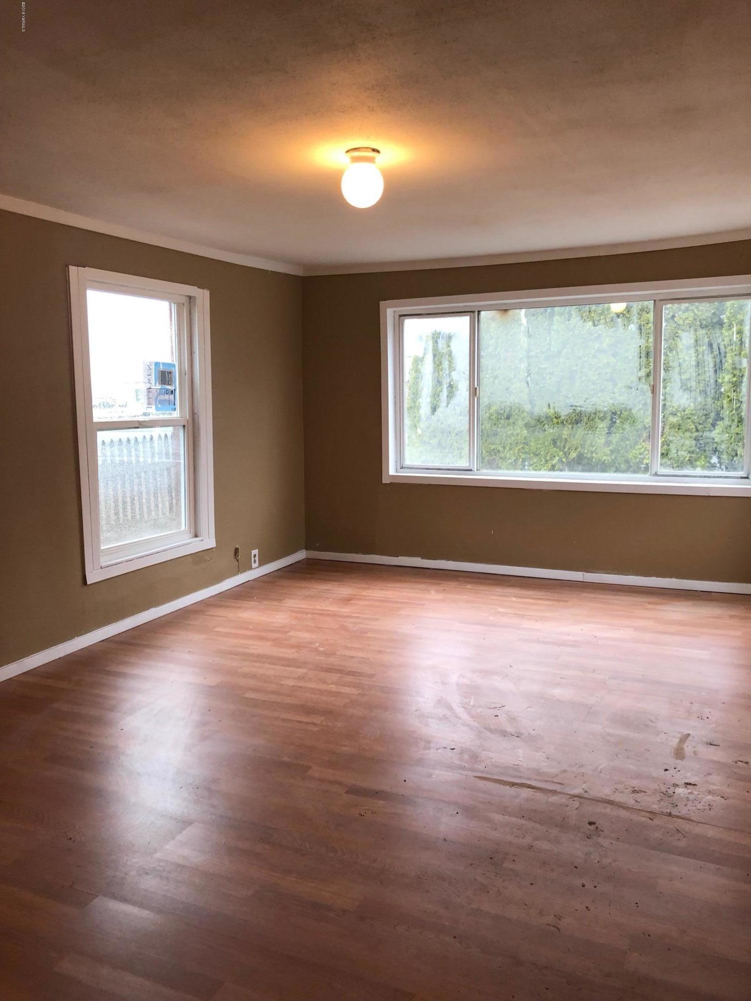 690 Outlook Road Outlook, WA 98938 - Photo 4 of 11 an empty room with wooden floor and windows
