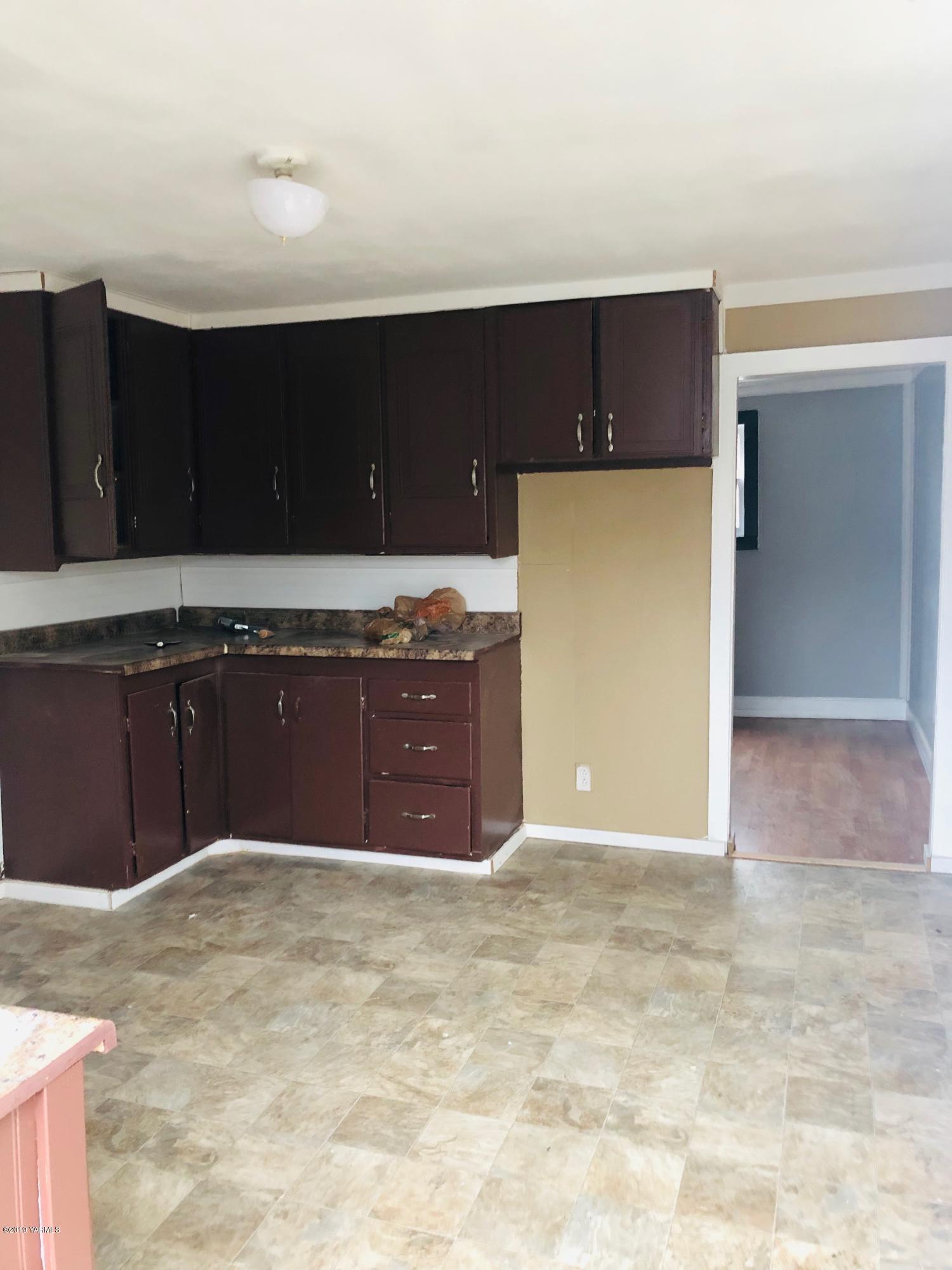 690 Outlook Road Outlook, WA 98938 - Photo 9 of 11 a kitchen with kitchen island and cabinets