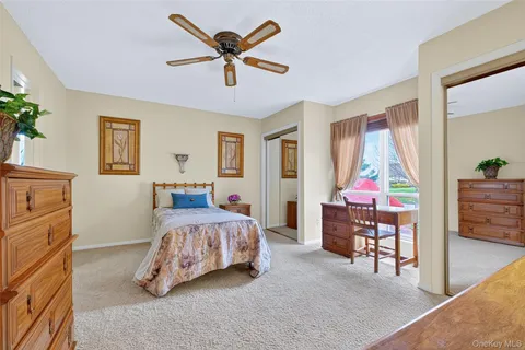 a bedroom with a bed and cabinets