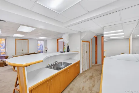 a kitchen with stainless steel appliances granite countertop a sink and cabinets