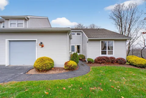a view of a backyard with table and chairs and a fire pit