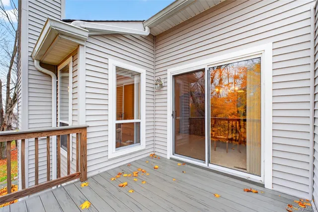 a view of porch with wooden floor