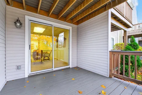 a view of porch with wooden floor
