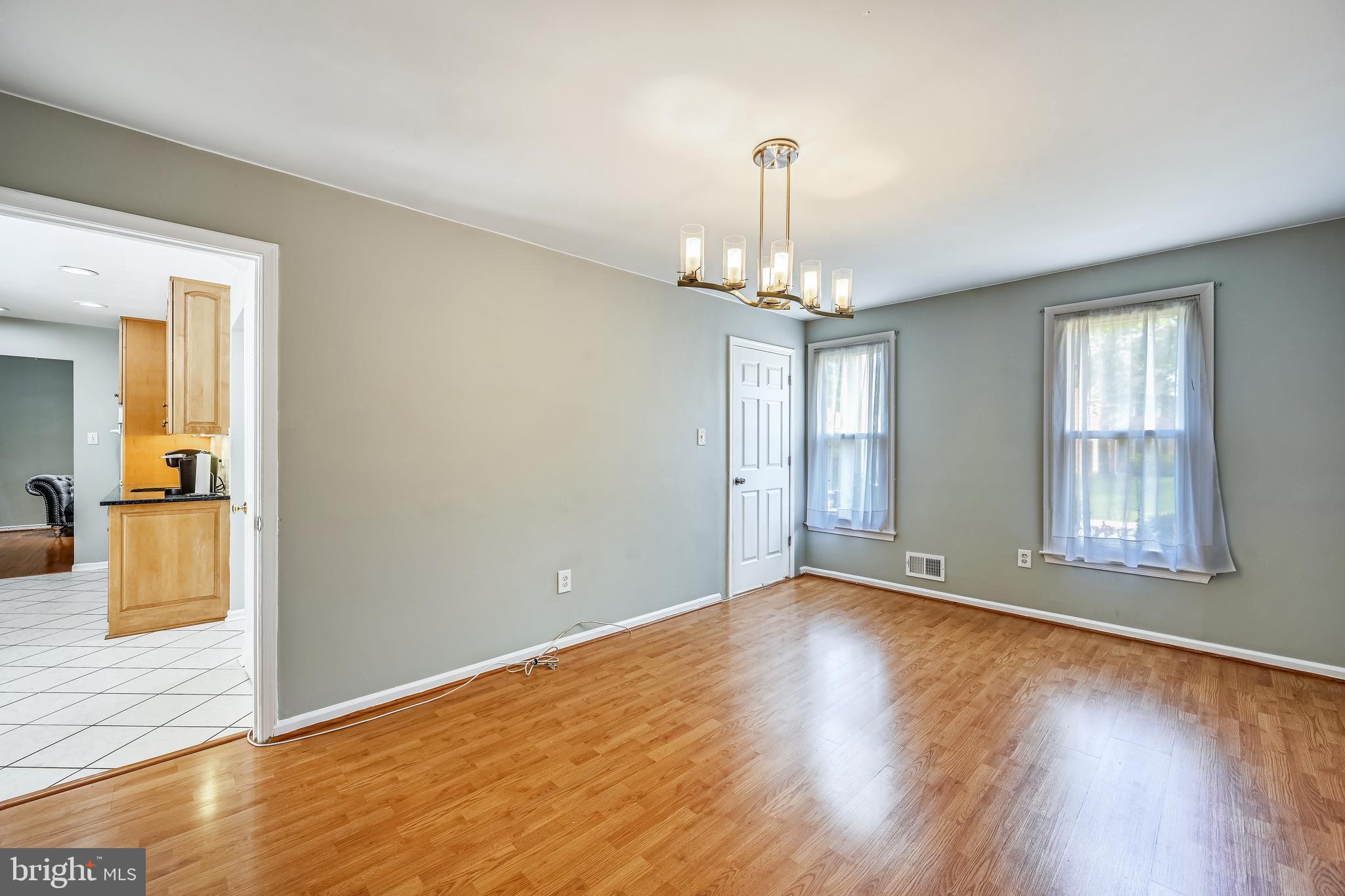 2116 Kings House Road Silver Spring, MD 20905 - Photo 16 of 37 a view of livingroom with hardwood floor and window