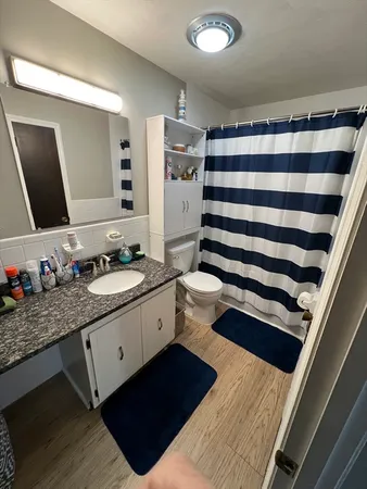 a bathroom with a double vanity sink and mirror