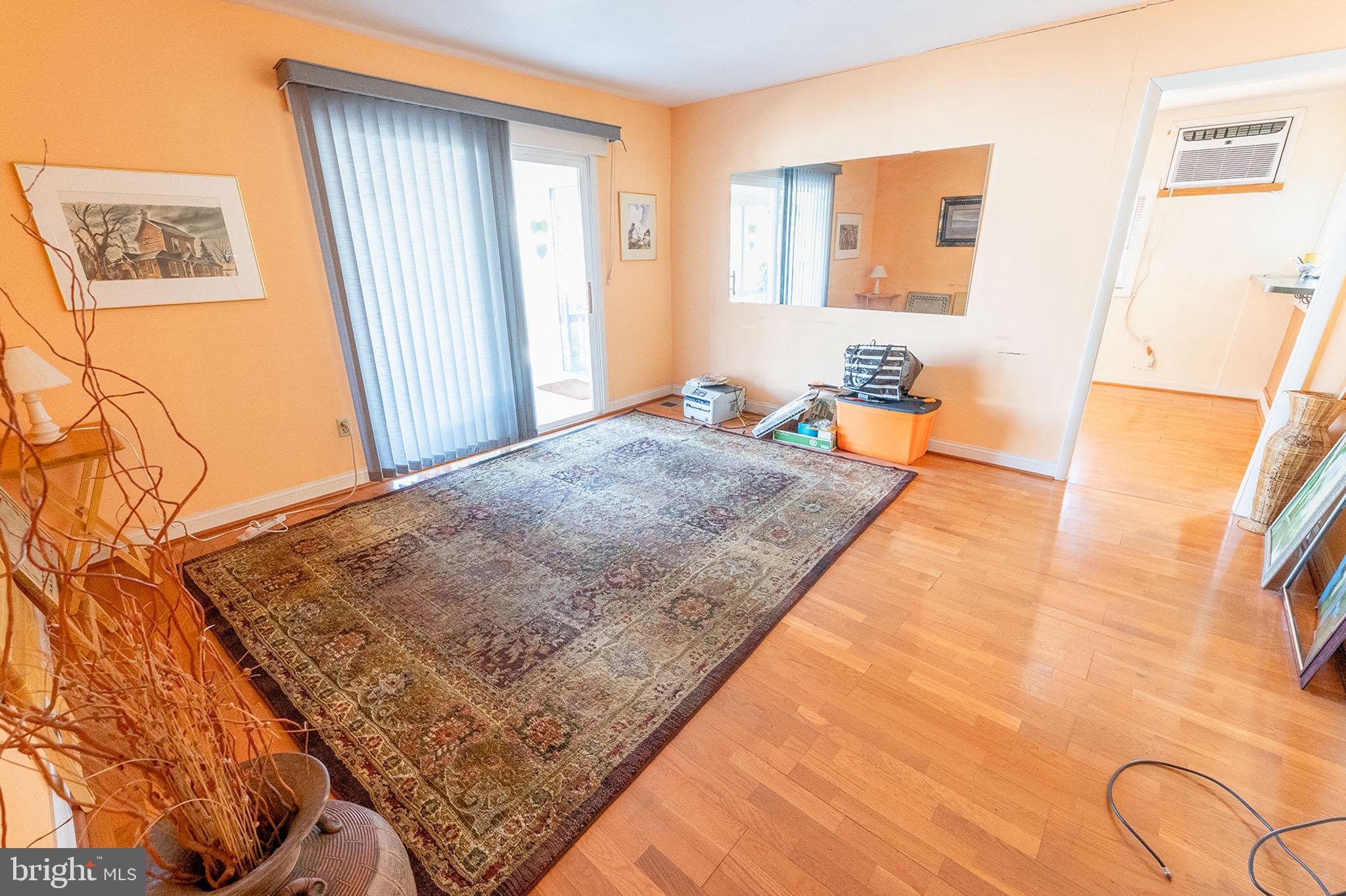 513 Eggert Crossing Road Ewing, NJ 08638 - Photo 13 of 36 a living room with a rug