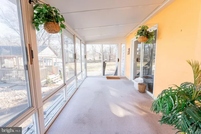a view of a room with window and floor to ceiling window