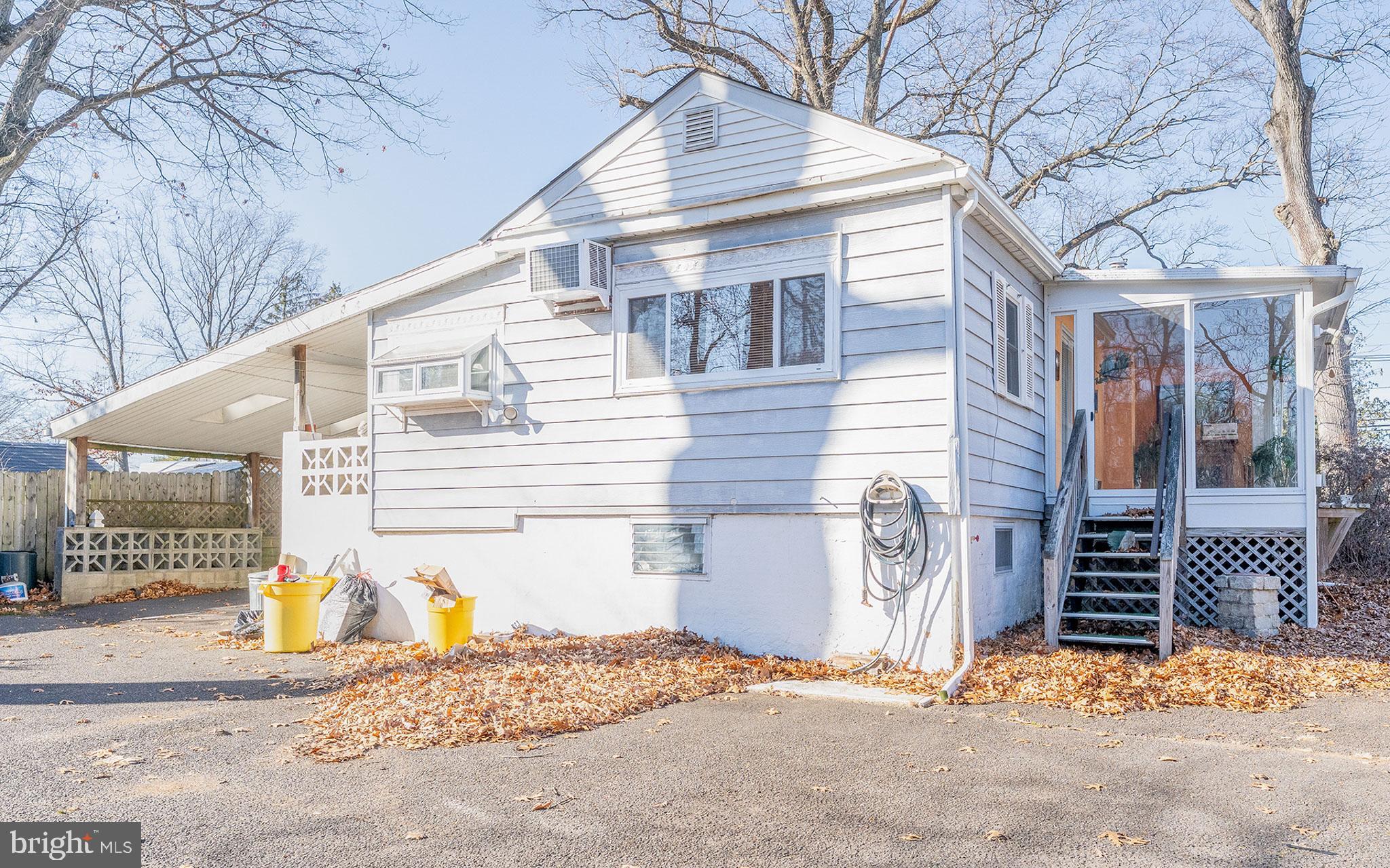 513 Eggert Crossing Road Ewing, NJ 08638 - Photo 3 of 36 a view of a house with wooden fence