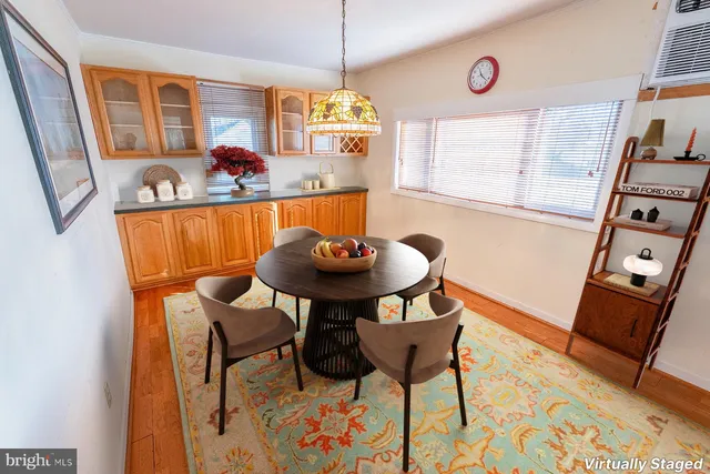 a view of a dining room with furniture and a window