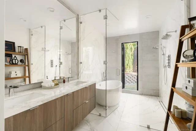 a view of backyard with outdoor seating and plants