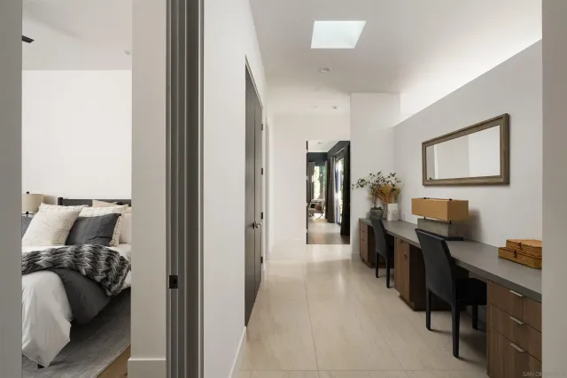 a view of a hallway with potted plants
