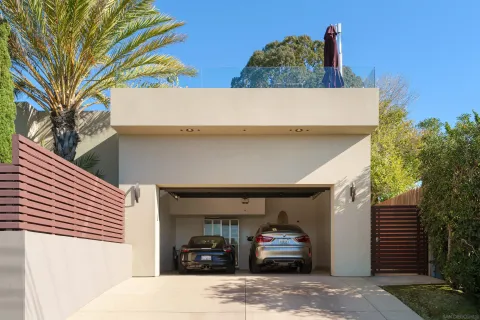 a view of a kitchen with stainless steel appliances kitchen island granite countertop a table and chairs in the counter