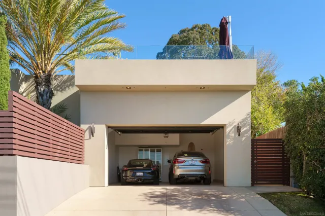 a view of a kitchen with stainless steel appliances kitchen island granite countertop a table and chairs in the counter
