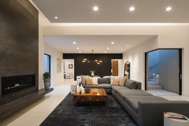 a view of a roof deck with couches and wooden floor