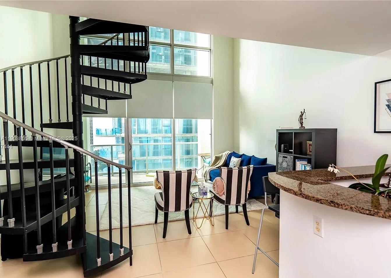 300 South Biscayne Boulevard, Unit L1208 Miami, FL 33131 - Photo 6 of 10 a view of a workspace with furniture