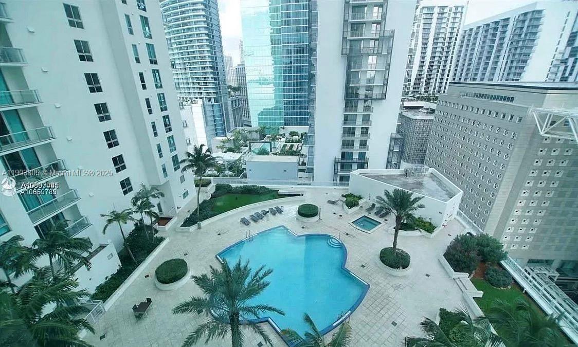 300 South Biscayne Boulevard, Unit L1208 Miami, FL 33131 - Photo 8 of 10 a view of a swimming pool with chairs