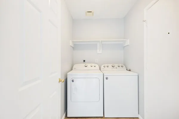 a utility room with dryer and washer