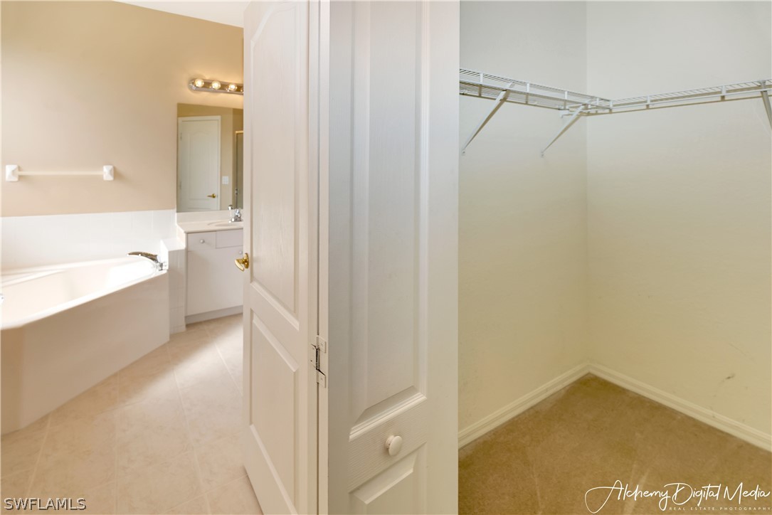 12625 Stone Valley Loop Fort Myers, FL 33913 - Photo 14 of 26 a bathroom with a bathtub and a shower