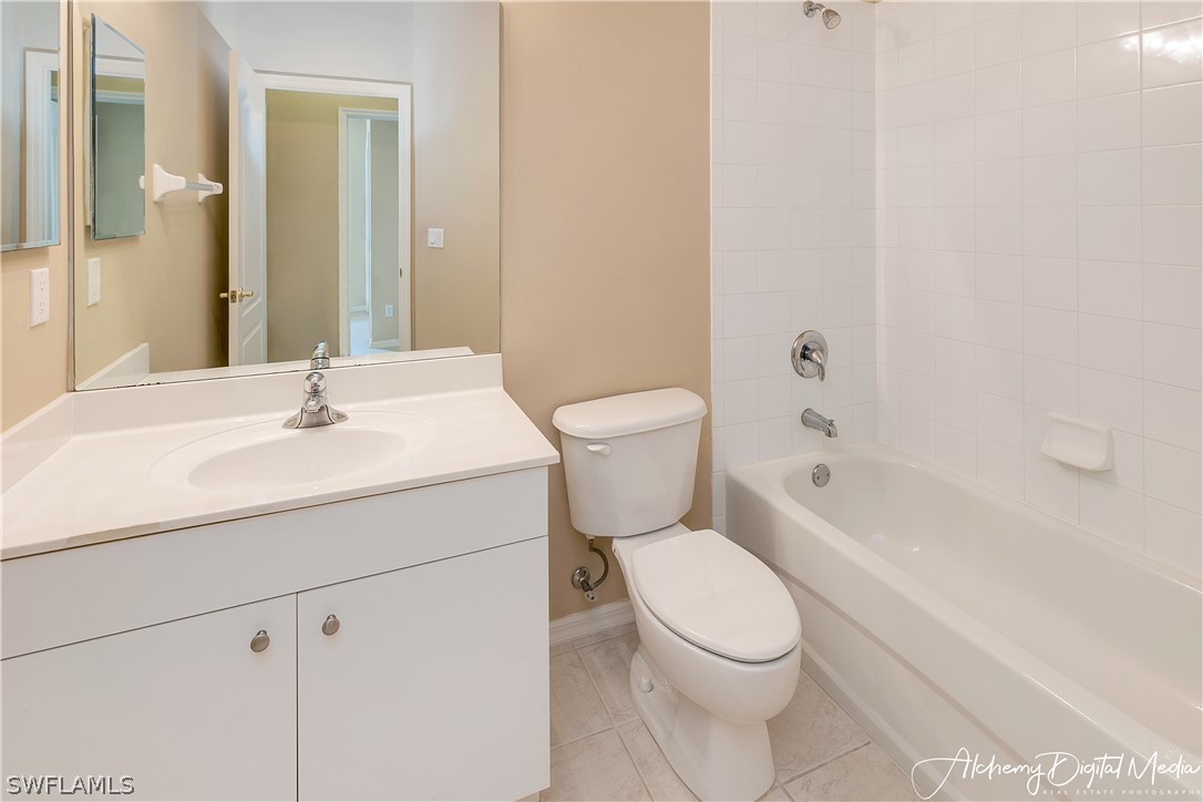 12625 Stone Valley Loop Fort Myers, FL 33913 - Photo 18 of 26 a white toilet sitting next to a bathroom sink