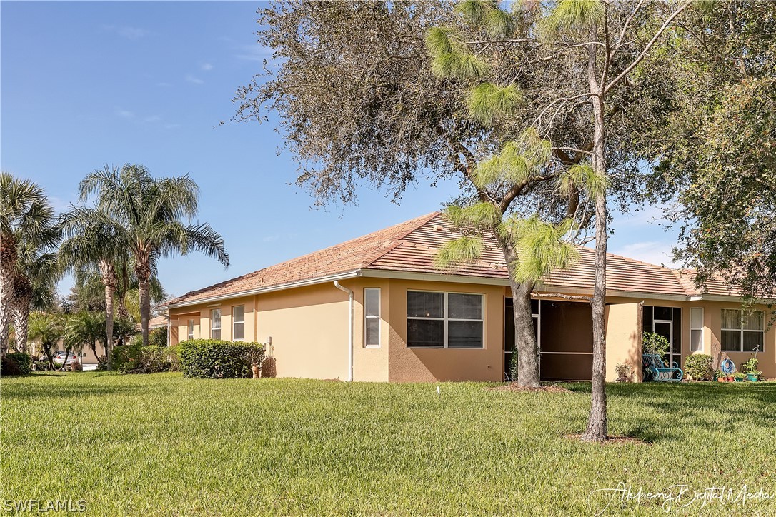 12625 Stone Valley Loop Fort Myers, FL 33913 - Photo 20 of 26 a view of a yard in front of a house