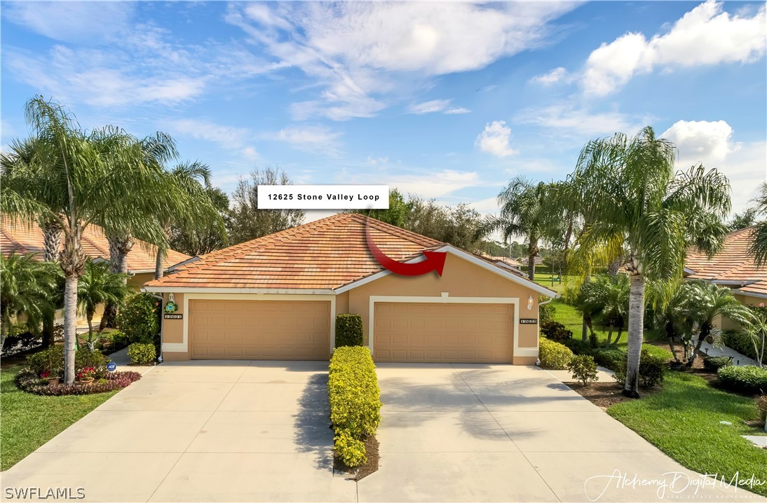 12625 Stone Valley Loop Fort Myers, FL 33913 - Photo 2 of 26 a front view of a house with a yard and garage