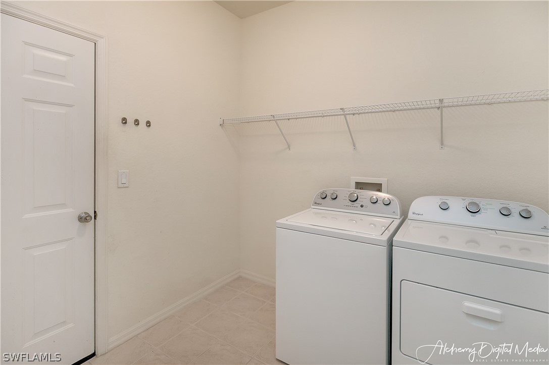 12625 Stone Valley Loop Fort Myers, FL 33913 - Photo 21 of 26 a view of storage and utility room with dryer and washer