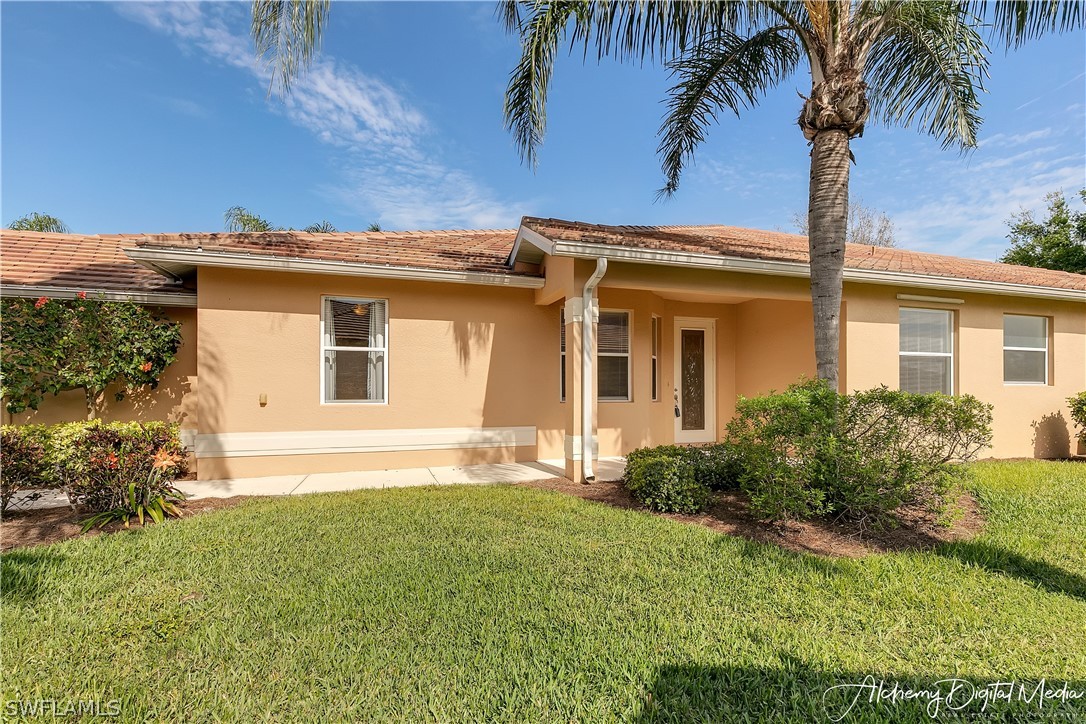 12625 Stone Valley Loop Fort Myers, FL 33913 - Photo 3 of 26 a view of a house with a yard