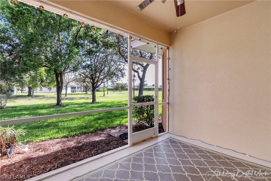 12625 Stone Valley Loop Fort Myers, FL 33913 - Photo 5 of 26 a view of a porch with a big yard and a large tree