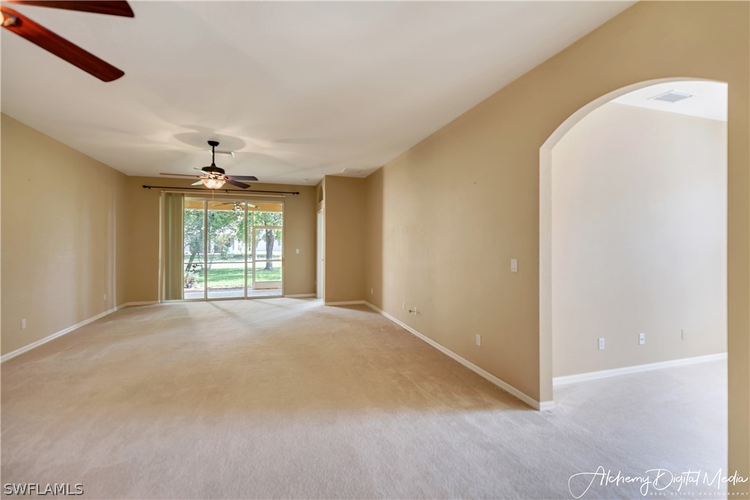 12625 Stone Valley Loop Fort Myers, FL 33913 - Photo 8 of 26 an empty room with a window and chandelier
