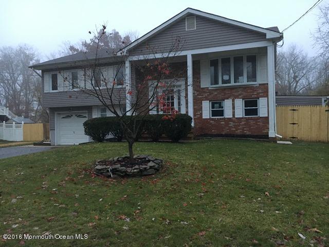 16 Windsor Road Howell, NJ 07731 - Photo 1 of 15 a front view of a house with a yard