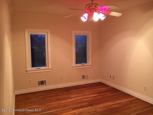 16 Windsor Road Howell, NJ 07731 - Photo 11 of 15 a view of an empty room with wooden floor and a window
