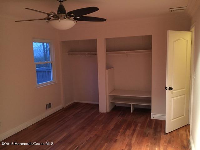 16 Windsor Road Howell, NJ 07731 - Photo 12 of 15 a view of empty room with wooden floor and fan