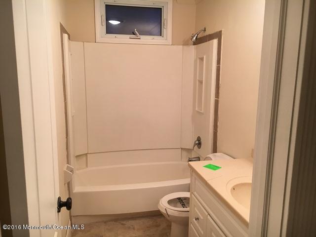 16 Windsor Road Howell, NJ 07731 - Photo 13 of 15 a bathroom with a bathtub toilet and sink