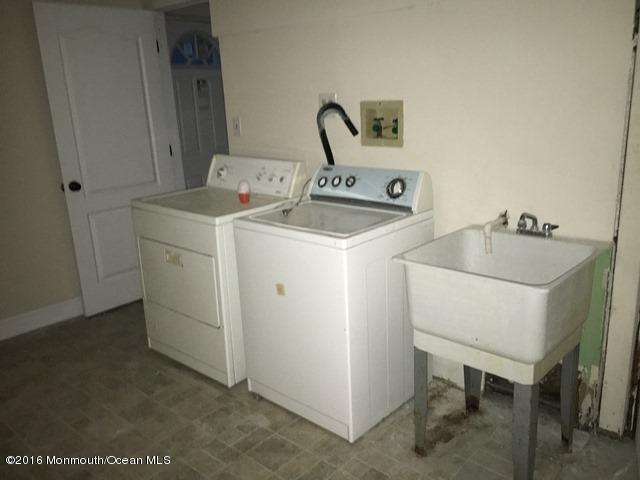 16 Windsor Road Howell, NJ 07731 - Photo 14 of 15 a utility room with dryer and washer