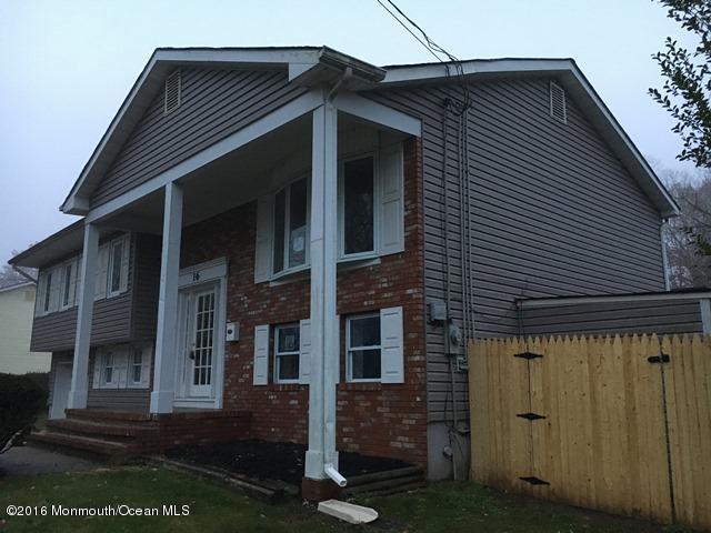16 Windsor Road Howell, NJ 07731 - Photo 3 of 15 a front view of a house with garden