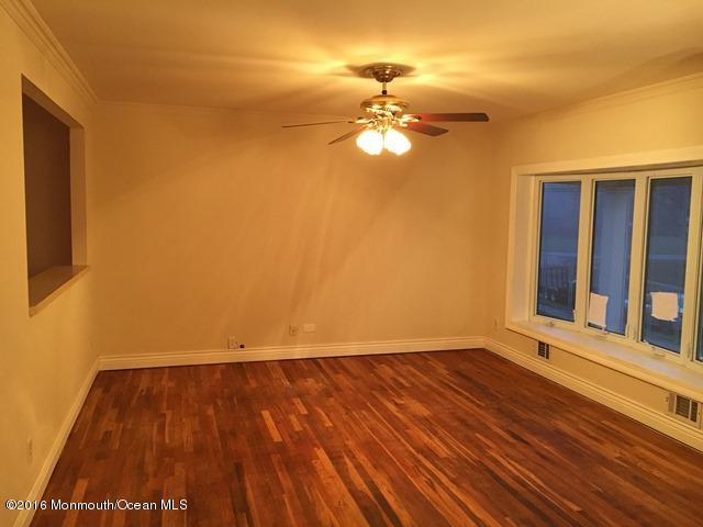 16 Windsor Road Howell, NJ 07731 - Photo 6 of 15 a view of a room with wooden floor and fan