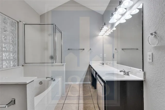 a bathroom with a sink a mirror and a shower