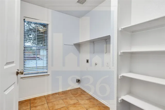 a bathroom with a tub and shower
