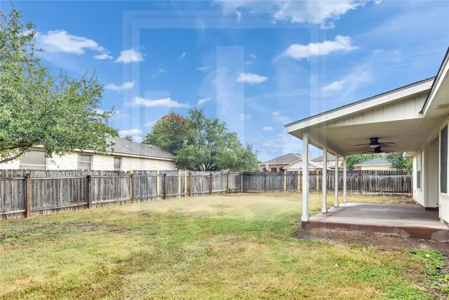 a view of swimming pool with a patio