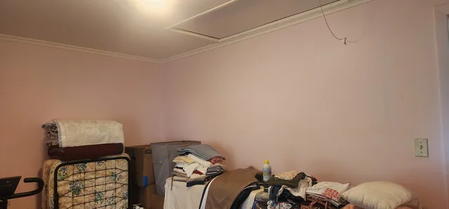 a bed room with a bed and a window